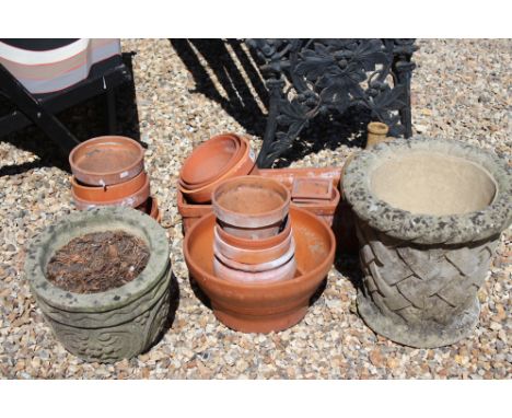 Collection of plant pots to include 16 terracotta and two reconstituted stone examples, together with a flagon (stone pots 28