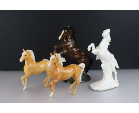 Three Beswick Horses to include a 1014 rearing horse and 2 x 1261 prancing Palomino Arab horses (1 a/f), together with anothe