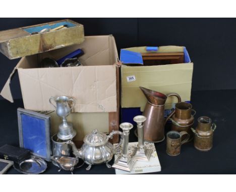 A large mixed collection of silver plated items to include cutlery / flatware, candlesticks, cruet set, frames, sauce boats, 