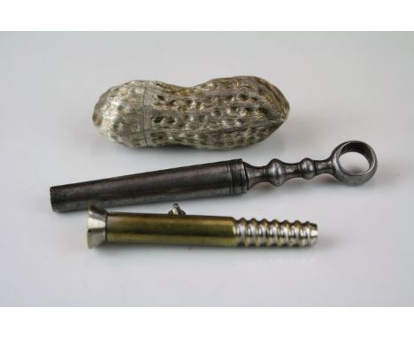 An antique pocket corkscrew together with a white metal Mexican / Taxco pill box in the form of a peanut. 