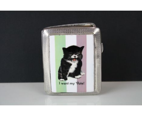 A silver cigarette case with later applied panel with suffragette image. 