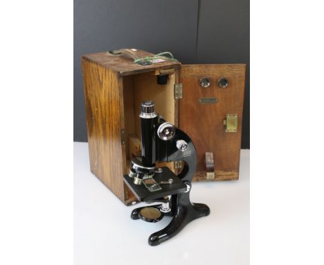 A Beck Ltd of London model 29 microscope, serial no.13487, complete with lenses and original fitted wooden case. 
