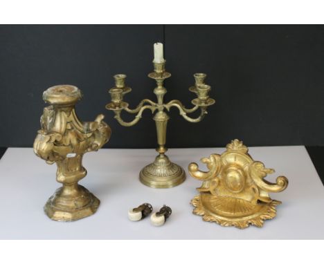 A brass five branch candlestick together with a gilt example and a bracket shelf. 