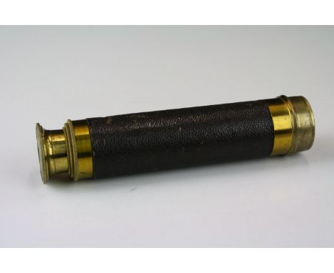 A brass and leather covered three drawer pocket telescope. 