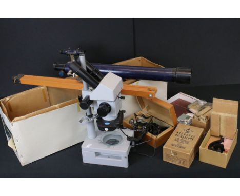 A boxed Astral 400 telescope together with a microscope, two students microscopes and various accessories. 