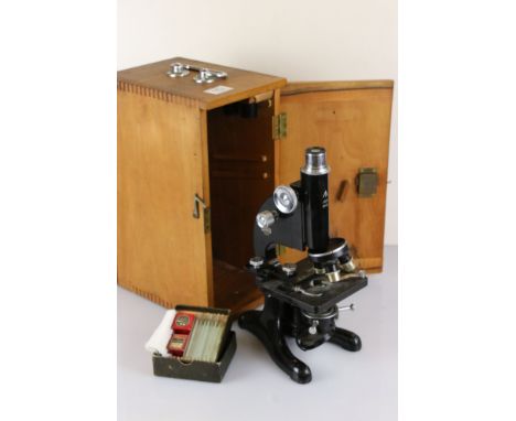 A British Military World War Two Issued Microscope complete with lenses, slides..etc. Dated July 1943 and marked with the Bri