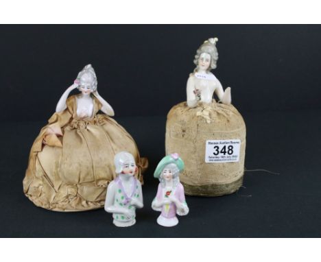 A collection of four antique ceramic pin cushion dolls. 