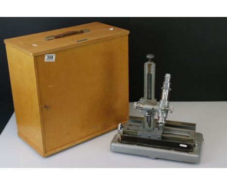 A Griffin &amp; George Ltd microscope complete with lenses and fitted wooden case. 