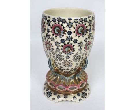 An Art Nouveau Fischer Budapest vase on stand Having scrolling floral decoration, raised on a pierced foot rim, factory marks
