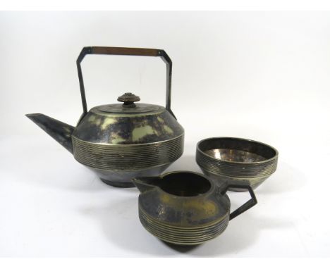 Dr Christopher Dresser for Richard Hodd & Son Silver-plated tea service, the teapot with angular wooden handle, impressed mar