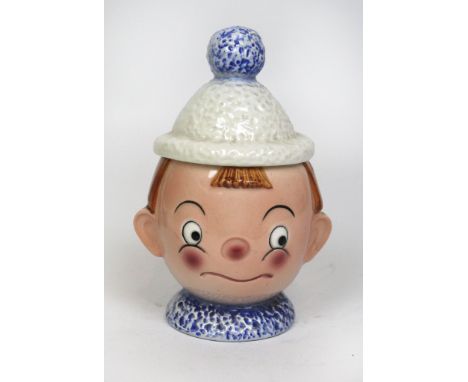 An Art Deco Goebel lidded potModelled in the form of a boy with bobble hat as the cover, factory marks to base, height 14cm 