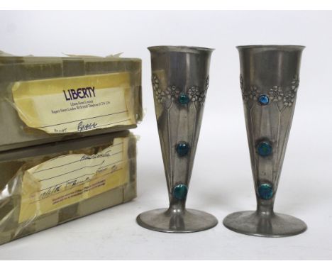 A pair of English Pewter for Liberty & Co Arts & Crafters pewter and enamel vases Each decorated in relief with floral sprays