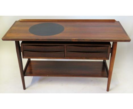 A Sibast Danish rosewood side table With circular serving plate inset, having four single freeze drawers, raised on column su