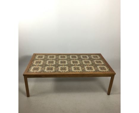 A Danish retro coffee tableOf rectangular form having eighteen ceramic tiles inset to top having stylised decoration, length 