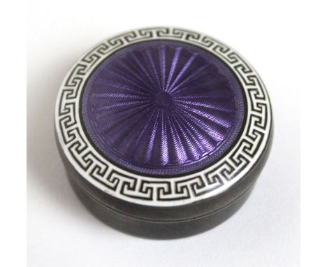 An Edward VII hallmarked silver and guilloche enamel powder compactOf circular form with purple enamel, made by Lawrence Emma
