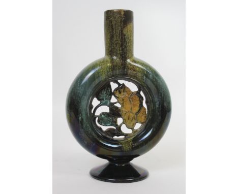 Dr Christopher Dresser for Linthorpe Pottery a rare Moon Flask vase With tube form neck, with central pierced foliate roundel