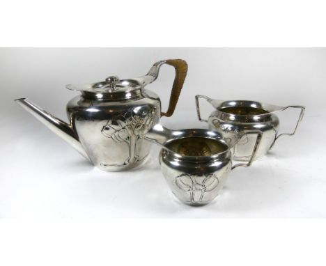 An Edward VII hallmarked silver three piece tea service Comprising teapot with wicker handle, twin handled sugar bowl and cre