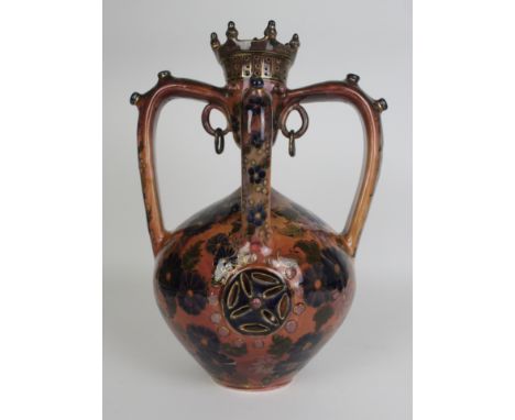 A large and impressive ceramic four handled puzzle vessel Possibly Zsolnay Pecs or Fischer Budapest, having painted floral de