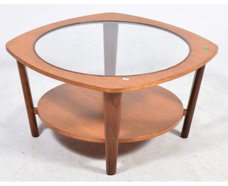 A stylish teak glass top coffee tableThe rounded square top inset with a circular glass panel above a circular under shelf, r