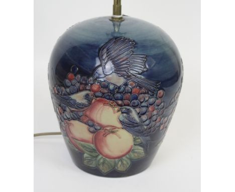 A modern Moorcroft table lamp of ovoid formDecorated in the Blue Finches pattern, factory marks to base, height 26cm, diamete