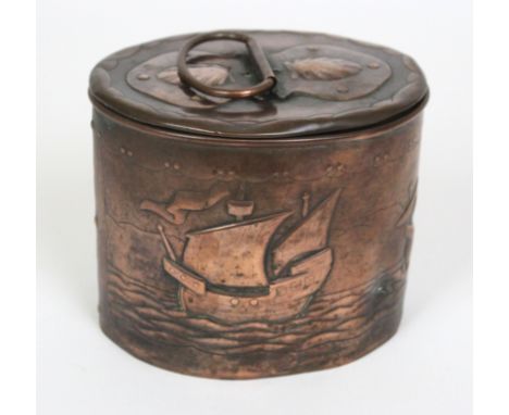 A Newlyn Arts & Crafts copper biscuit boxOf oval form, embossed with open shells and galleons, impressed marks to base, heigh