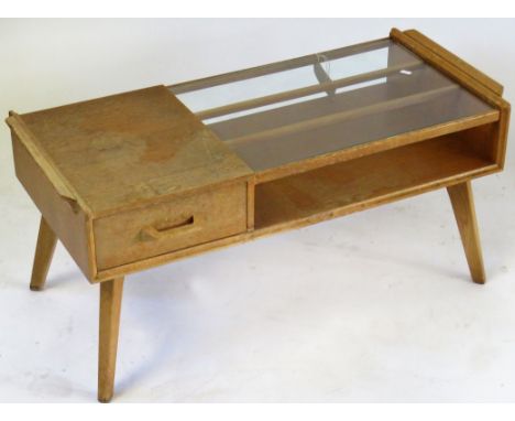 A Mid Century light oak coffee table Having single freeze drawer with glass top, height 41cm, length 88cm, width 40cmCONDITON