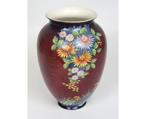 An Art Deco Carlton Ware vaseOf shouldered form with floral decoration on a red glazed ground, factory marks to base, height 