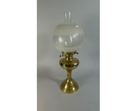 A Brass Oil Lamp with Shade and Chimney, 54cm high 