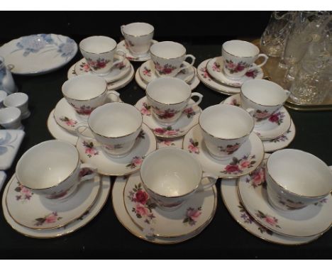 A Rose Pattern Tea Set by Ashley Bone China to Include Nine Trios and Three Cups and Saucers