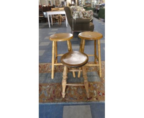 A Vintage Circular Topped Stool and Two Modern Examples