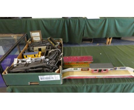 A Box Containing O Gauge Railway Track, Tin Plate and Wood Station Models, Goods Wagons etc