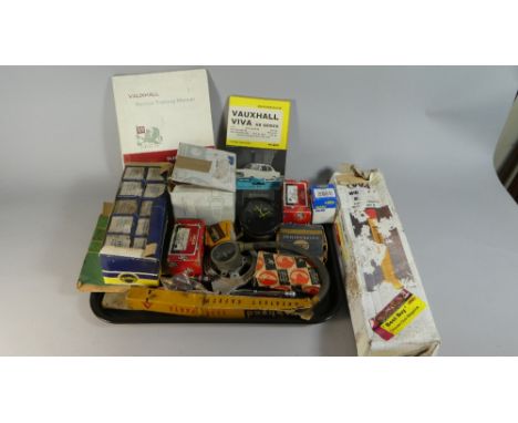 A Collection of Various Vintage Motoring Accessories to Include Light Bulbs, Lamps, Dials, Training Manuals, Motoring Manual 