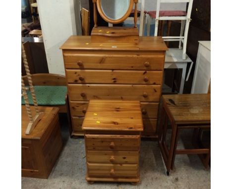 A PINE FIVE DRAWER CHEST, BEDSIDE CHEST + A MIRROR