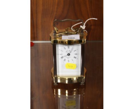AN ANTIQUE FRENCH BRASS CARRIAGE CLOCK 