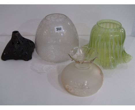LAMP SHADES, yellow vaseline glass oil lamp shade, also an etched glass lamp shade and ornate cast iron base, 1 other shade a