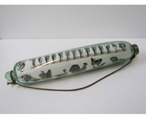 ANTIQUE GLASS, antique glass rolling pin, internally decorated with prints including military figures, animals, butterflies, 