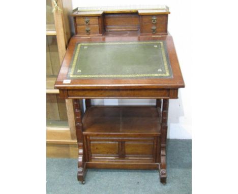 OAK DAVENPORT with brass gallery rail to top, 4 trinket drawers, fitted lower shelf with 2 drawers to left hand side, 58cm wi