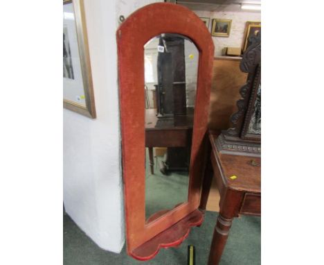 BEVEL EDGED WALL MIRROR, shaped mirror in an upholstered frame with lower shaped shelf, 138cm height 