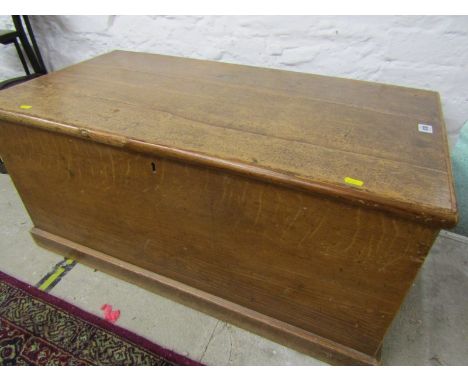 19th CENTURY WAXED PINE TRUNK, the rising top enclosing inner candle shelf, 92cm 