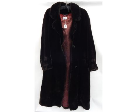 A faux-beaver coat by Penny Plain  Live Bidding: If you would like a condition report on this lot, please contact us at info@