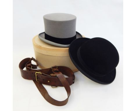 A grey top hat by Christys' London, size 71/8, a bowler hat, a leather belt with brass fittings and strap, possibly army and 