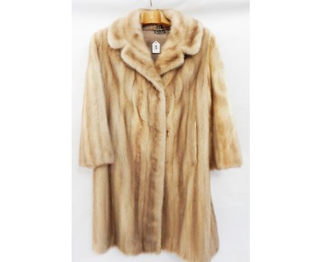 A blonde mink full-length coat  Live Bidding: If you would like a condition report on this lot, please contact us at info@cot