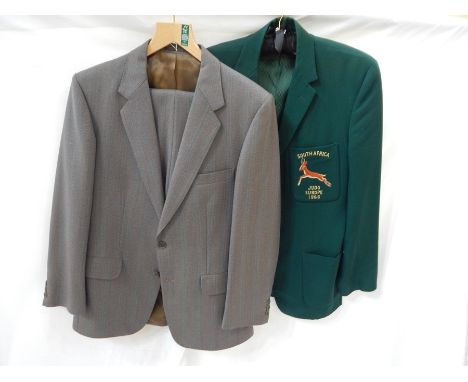 A vintage grey suit, a tweed vintage gentleman's suit, a V-neck cricket sweater, a green blazer with insignia on breast pocke