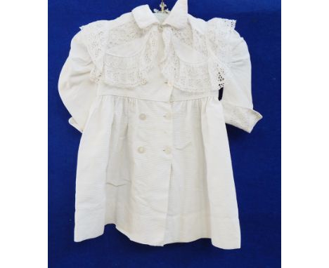 A child's cotton coat with a full broderie anglaise collar, double-breasted, a cotton baby gown with broderie anglaise detail