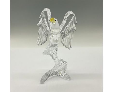 Stunning cut crystal figure of a mighty eagle perched with wings expanded. The bald eagle is made from faceted clear and fros