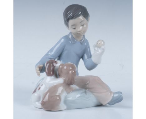 A glossy figure capturing a tender moment between a young child and a beloved animal companion. This item comes in its origin