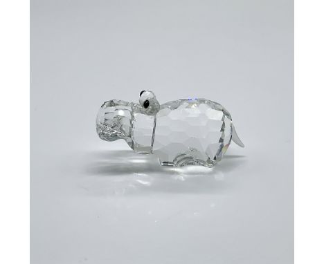 Part of the African Wildlife collection. A clear crystal hippo with black eyes and frosted tail. Swarovski swan mark. This it