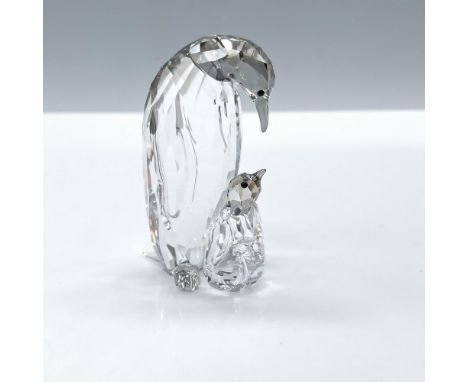 Dazzling facetted clear crystal with a satin coating. Capturing a beautiful moment between an Emperor Penguin mother and her 