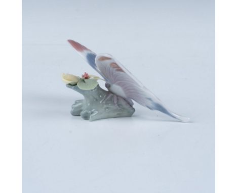 A glossy figure of a beautiful butterfly. This item comes in its original box, measuring 6"L x 5.5"W x 4.25"H. Lladro backsta