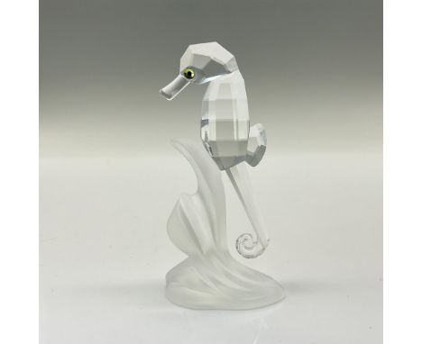 This Swarovski crystal seahorse is made from clear crystal and is attached to a frosted piece of crystal. The seahorse was or